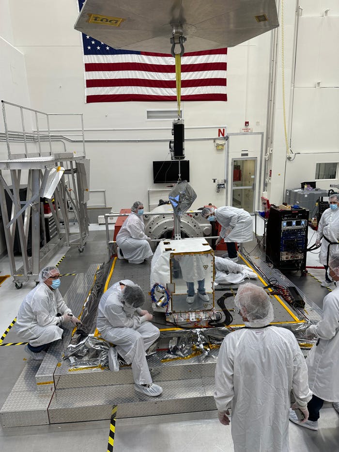 Engineers prepare the imaging spectrometer instrument for vibration testing at JPL. Image Credit: NASA/JPL-Caltech