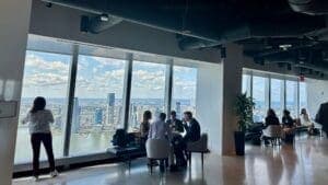 Guests at the NYC Climate Week event mingle as they enjoy spectacular views from the 64th floor of One World Trade Center in Manhattan.