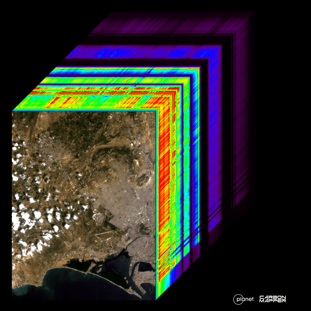 A hypercube visualizing the range of wavelengths collected by Tanager during first light. In the lower left is a visible-light image of Karachi, Pakistan, collected on September 19th, 2024. Up and to the right is a cross section of all the bands collected by Tanager spanning from 400 - 2500 nm.