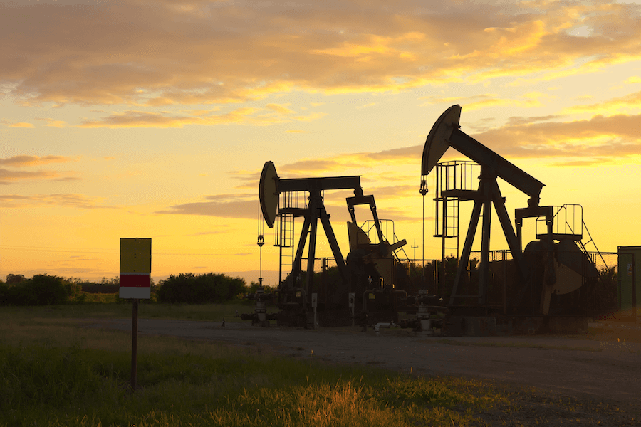 oil rigs at sunset