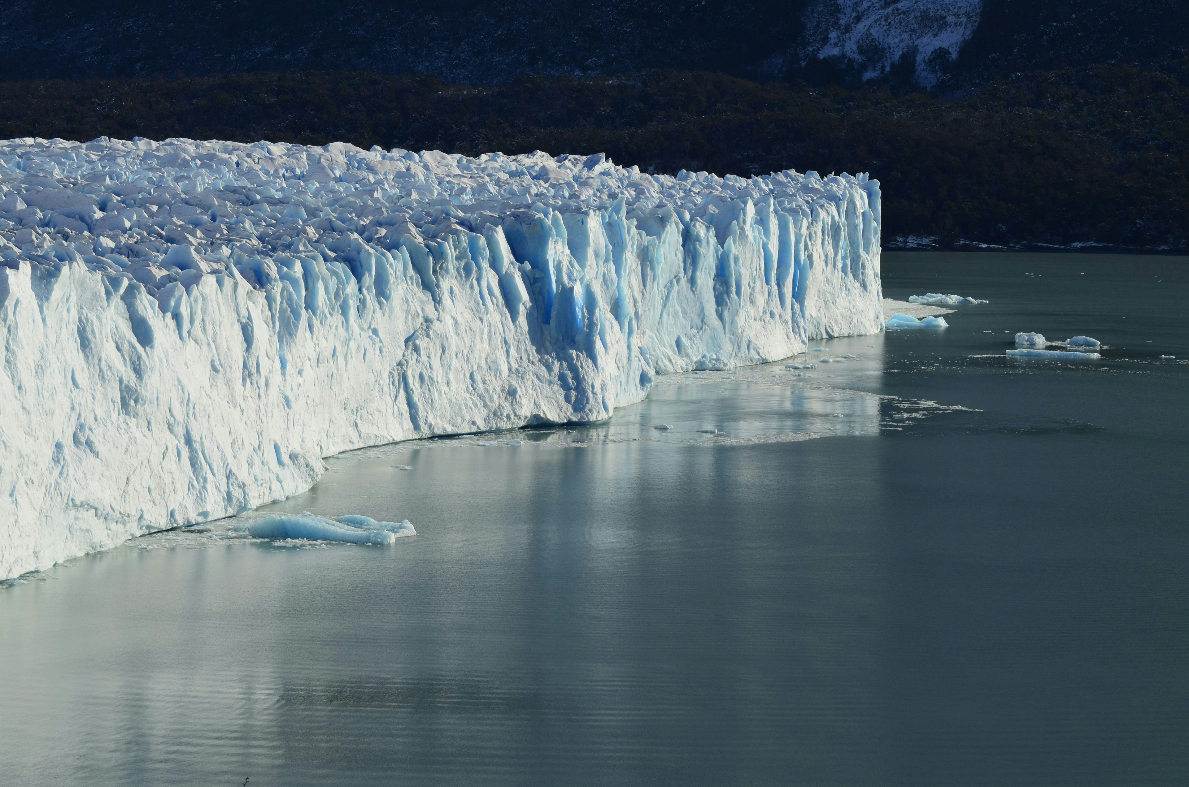 Image of ice cliff near body of water