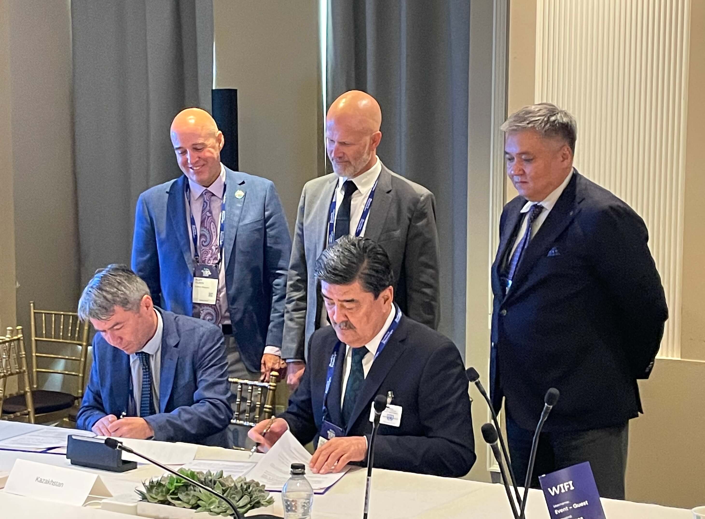 an image of carbon Mapper ceo riley duren and others during the Kazakhstan MoU signing