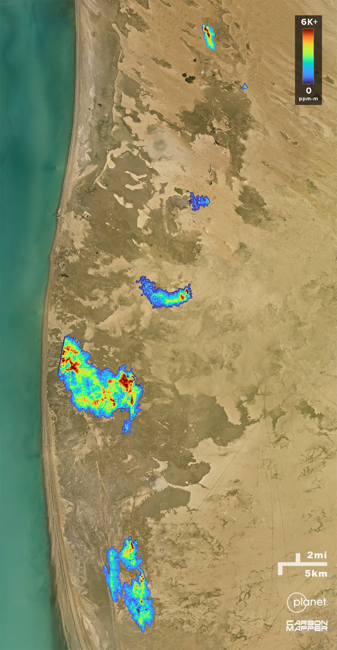 On the background of a satellite image, methane plumes can be seen across a stretch of the Turkmenistan cost. They are colored with a gradient that matches the methane emissions intensity of each plume's emissions.